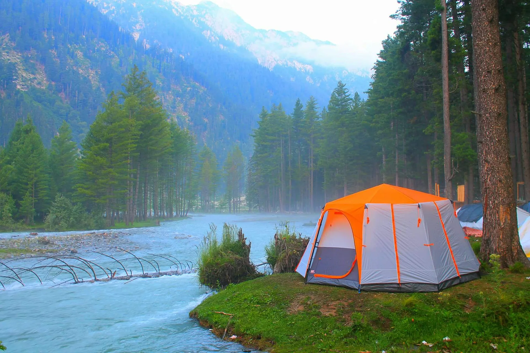 The river running through the green forests of Kumrat Valley
